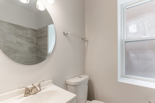 bathroom with toilet and vanity