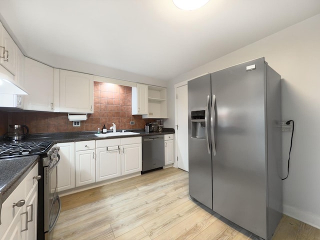 120 Collen Dr Unit 219, Lombard, IL 60148 - kitchen with appliances with stainless steel finishes, a sink, light wood-style flooring, dark countertops, and white cabinets