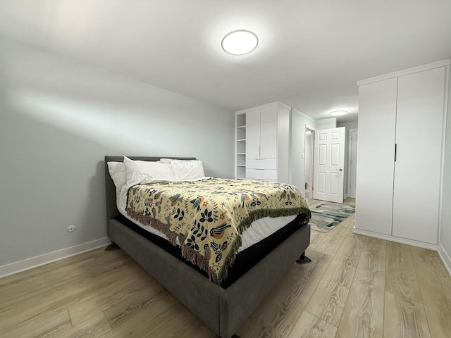 120 Collen Dr Unit 219, Lombard, IL 60148 - bedroom featuring light wood-style flooring and baseboards