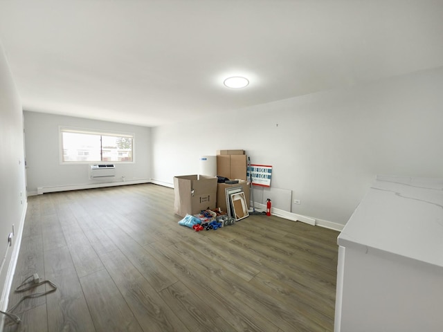 120 Collen Dr Unit 219, Lombard, IL 60148 - unfurnished room featuring wood finished floors, baseboards, an AC wall unit, and baseboard heating