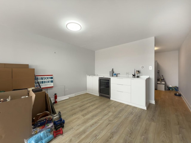 120 Collen Dr Unit 219, Lombard, IL 60148 - indoor wet bar with light wood-style flooring, beverage cooler, and baseboards