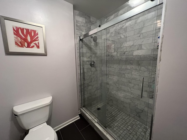 2125 N Clark St Unit 3, Chicago, IL 60614 - full bathroom with toilet, a shower stall, baseboards, and tile patterned floors