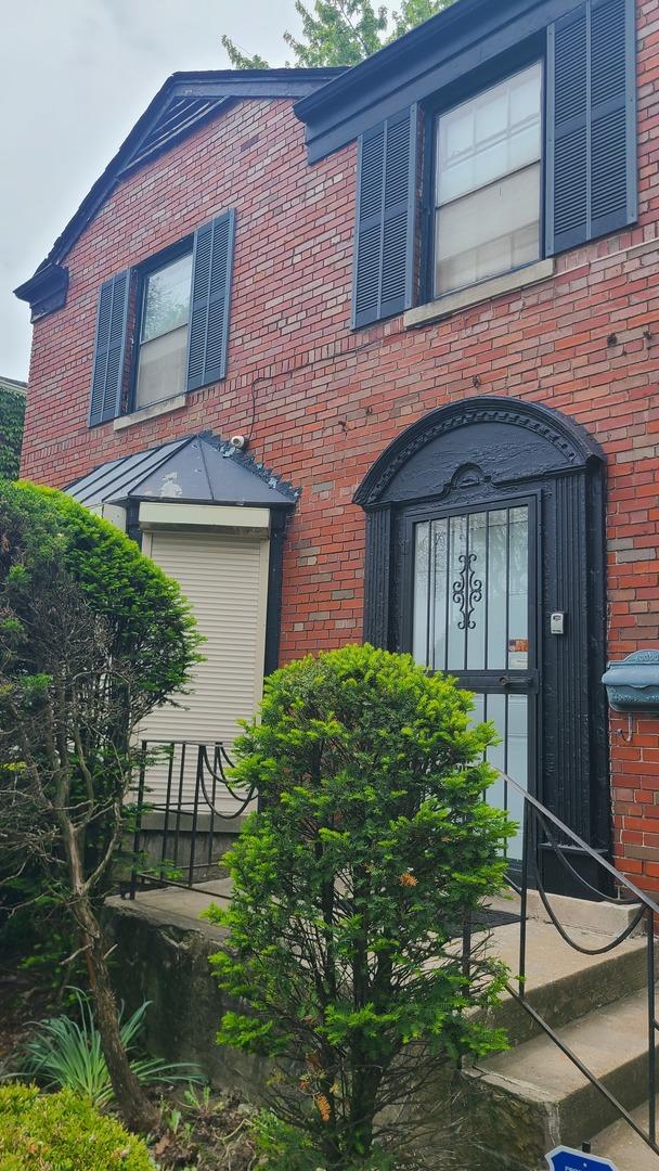 8214 S Yates Blvd, Chicago, IL 60617 - view of front of house with brick siding