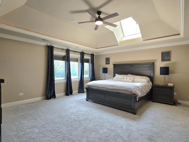 18545 S Marilynn Ct, Mokena, IL 60448 - carpeted bedroom featuring a raised ceiling, ornamental molding, a skylight, baseboards, and ceiling fan