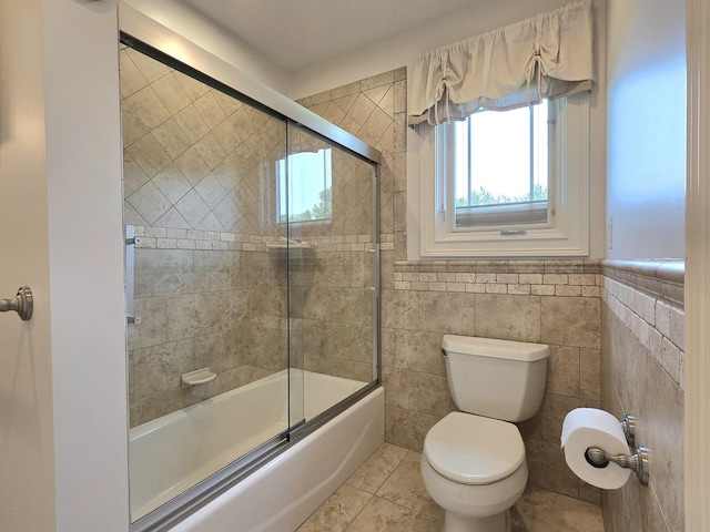 18545 S Marilynn Ct, Mokena, IL 60448 - bathroom featuring toilet, combined bath / shower with glass door, and tile walls