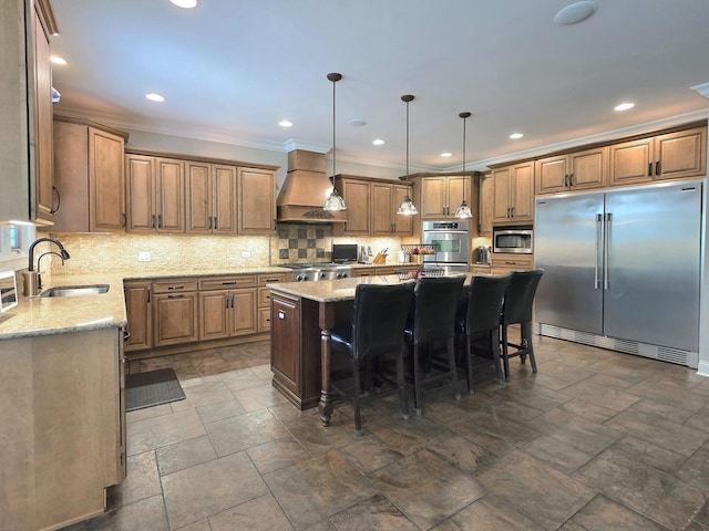 18545 S Marilynn Ct, Mokena, IL 60448 - kitchen featuring built in appliances, premium range hood, a sink, a center island, and a breakfast bar area