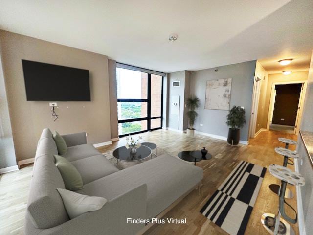 1160 S Michigan Ave Unit 2105, Chicago, IL 60605 - living room featuring baseboards, wood finished floors, and a wall of windows
