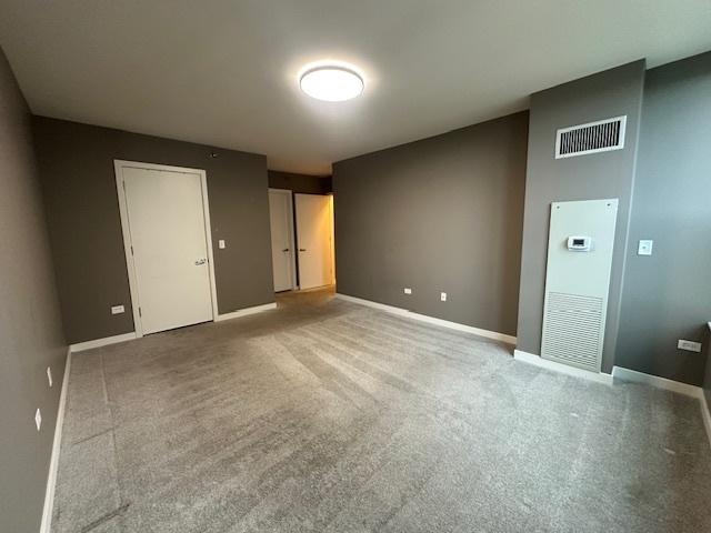 1160 S Michigan Ave Unit 2105, Chicago, IL 60605 - unfurnished bedroom with baseboards and carpet floors