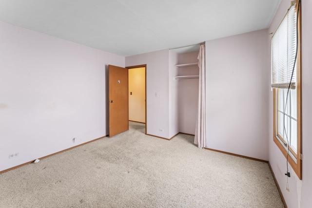 185 Mohawk Trl, Buffalo Grove, IL 60089 - unfurnished bedroom with light colored carpet, baseboards, and a closet
