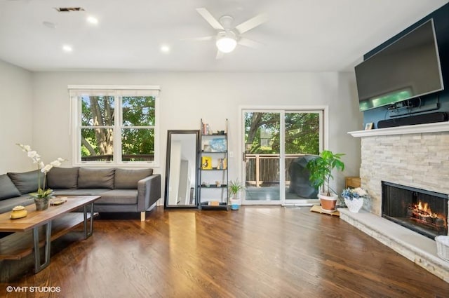 1800 W Diversey Pkwy Unit F, Chicago, IL 60614 - living room featuring plenty of natural light, a fireplace, ceiling fan, and wood finished floors