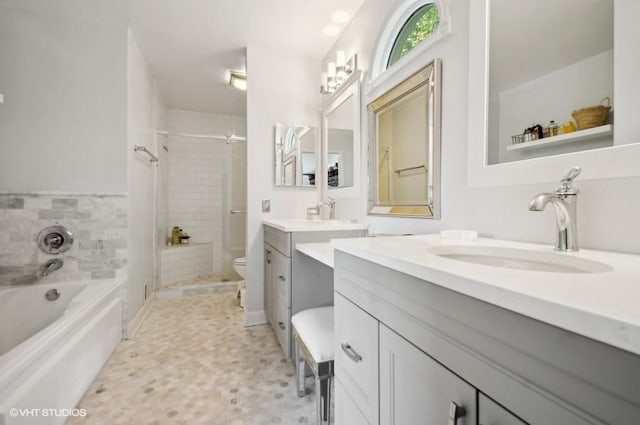 1800 W Diversey Pkwy Unit F, Chicago, IL 60614 - bathroom with vanity, a garden tub, a stall shower, and toilet
