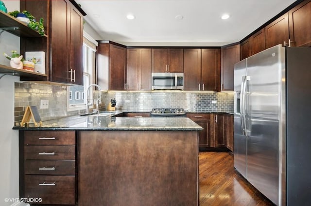 1800 W Diversey Pkwy Unit F, Chicago, IL 60614 - kitchen with appliances with stainless steel finishes, a sink, dark stone countertops, a peninsula, and open shelves
