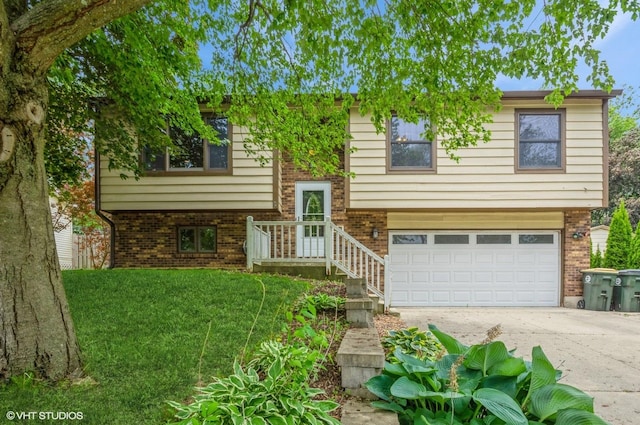 6407 Hillcrest Rd, Cary, IL 60013 - bi-level home featuring an attached garage, brick siding, and concrete driveway