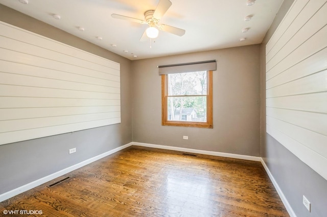 6407 Hillcrest Rd, Cary, IL 60013 - spare room featuring wood finished floors, a ceiling fan, and baseboards