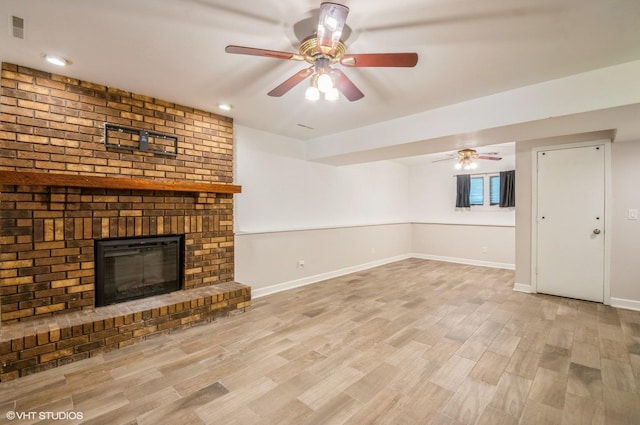 6407 Hillcrest Rd, Cary, IL 60013 - unfurnished living room with wood finished floors, baseboards, a ceiling fan, a fireplace, and recessed lighting