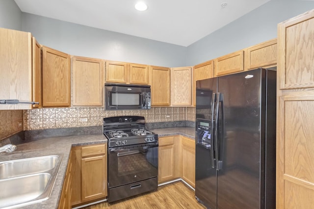 2215 Aurora Dr Unit 1, Pingree Grove, IL 60140 - kitchen featuring black appliances, a sink, light brown cabinets, backsplash, and light wood finished floors