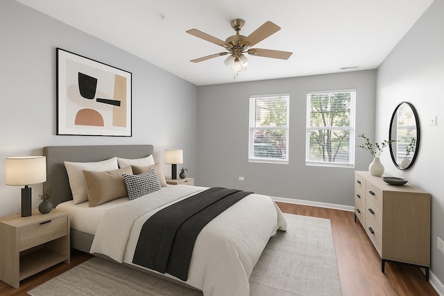 2215 Aurora Dr Unit 1, Pingree Grove, IL 60140 - bedroom with wood finished floors, baseboards, and a ceiling fan