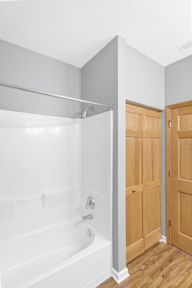 2215 Aurora Dr Unit 1, Pingree Grove, IL 60140 - bathroom with wood finished floors, shower / washtub combination, and a closet