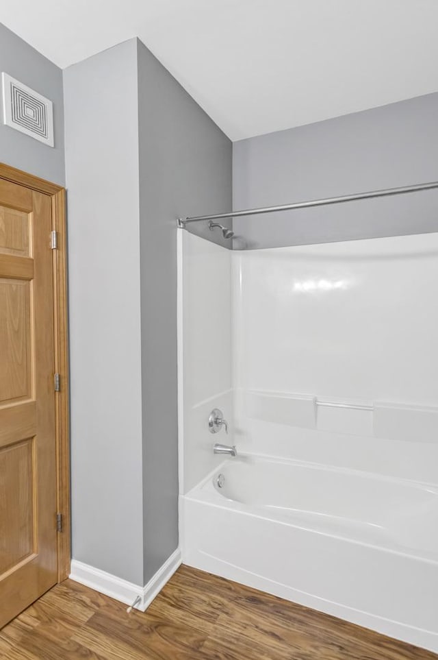 2215 Aurora Dr Unit 1, Pingree Grove, IL 60140 - full bath with wood finished floors, washtub / shower combination, and baseboards