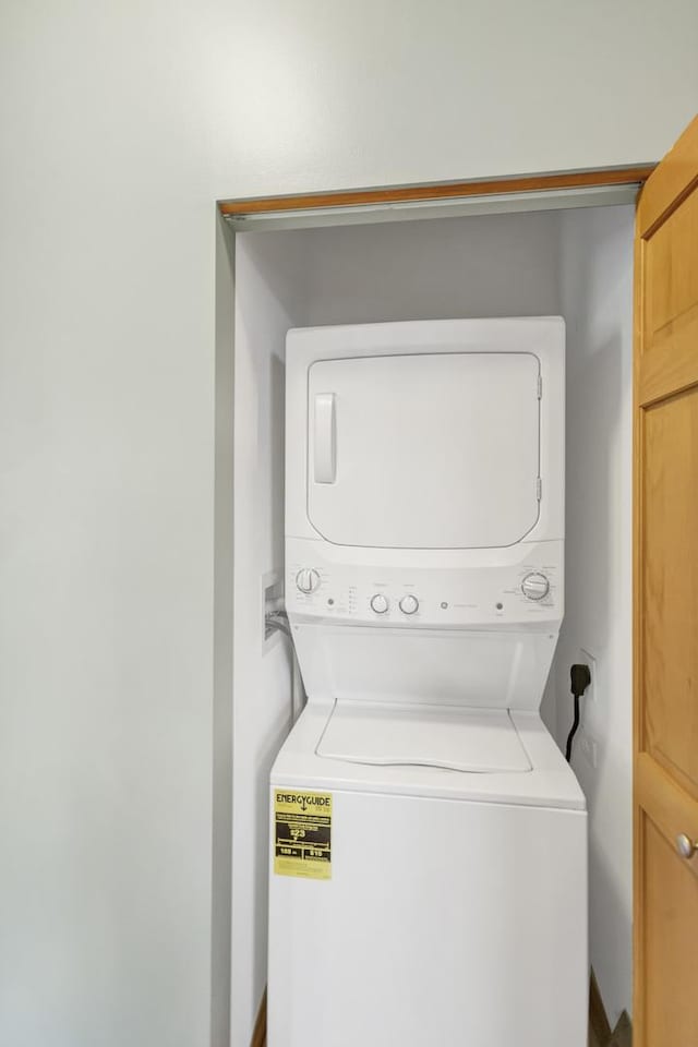 2215 Aurora Dr Unit 1, Pingree Grove, IL 60140 - washroom featuring stacked washing machine and dryer