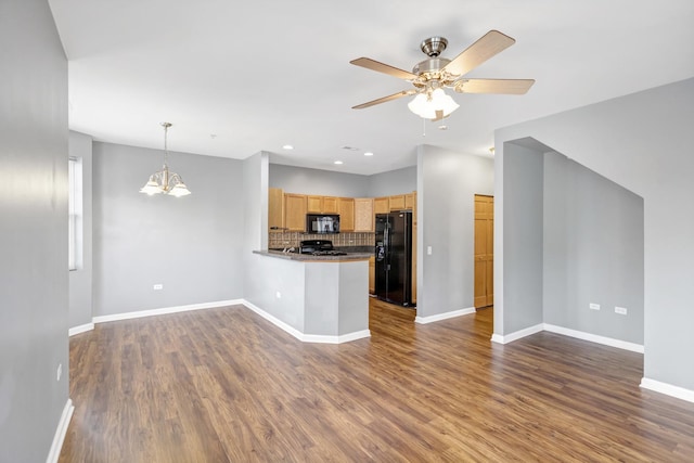 2215 Aurora Dr Unit 1, Pingree Grove, IL 60140 - kitchen featuring black appliances, open floor plan, decorative backsplash, a ceiling fan, and a peninsula