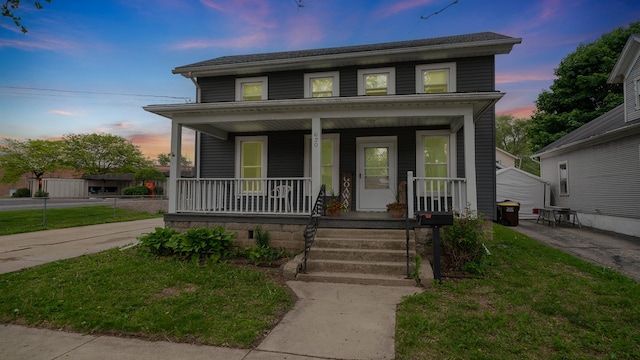 620 S Main St, Belvidere, IL 61008 - view of front of house with covered porch and a yard