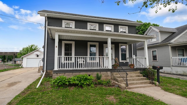 620 S Main St, Belvidere, IL 61008 - view of front of property featuring covered porch, an outbuilding, and a garage