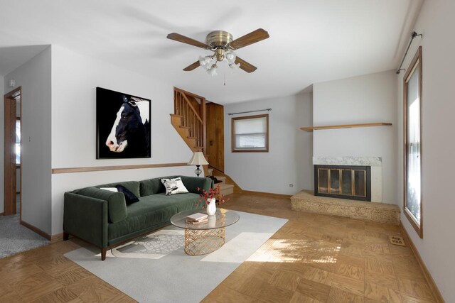 1141 Hartford Ln, Elk Grove Village, IL 60007 - living room featuring a premium fireplace, stairs, ceiling fan, and baseboards