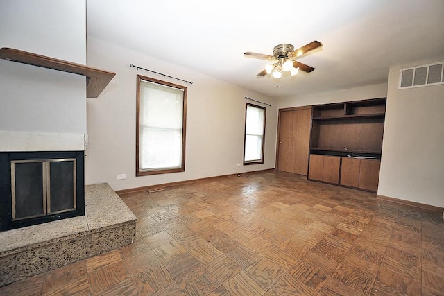 1141 Hartford Ln, Elk Grove Village, IL 60007 - unfurnished living room featuring ceiling fan and a multi sided fireplace