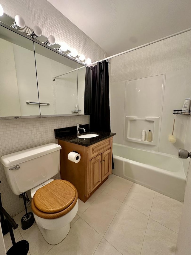 1700 E 56th St Unit 1706, Chicago, IL 60637 - full bathroom with shower / bath combo with shower curtain, tile patterned flooring, toilet, vanity, and tile walls