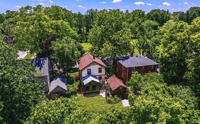 204 W Florida Ave, Urbana, IL 61801 - view of property exterior featuring a balcony and covered porch