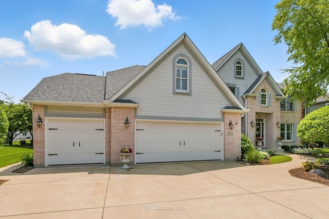 24255 Cropland Dr, Plainfield, IL 60544 - traditional-style house featuring brick siding, concrete driveway, a shingled roof, and a garage