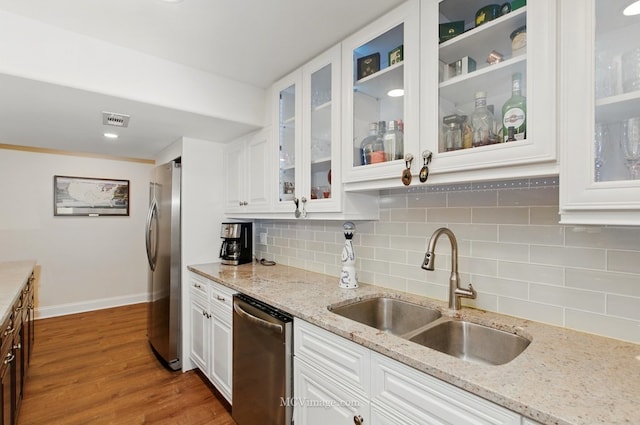 24255 Cropland Dr, Plainfield, IL 60544 - kitchen featuring appliances with stainless steel finishes, a sink, white cabinetry, and baseboards