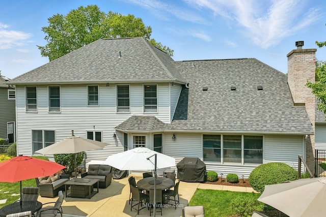 24255 Cropland Dr, Plainfield, IL 60544 - back of house featuring an outdoor hangout area, a shingled roof, and a patio