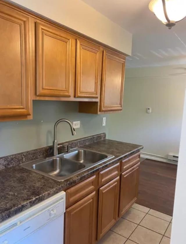 1840 W Hatherleigh Ct Unit 2D, Mount Prospect, IL 60056 - kitchen featuring white dishwasher, dark countertops, brown cabinetry, and light tile patterned floors