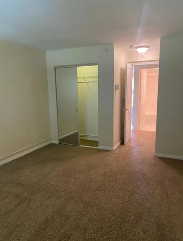 1840 W Hatherleigh Ct Unit 2D, Mount Prospect, IL 60056 - unfurnished bedroom with carpet flooring and a closet