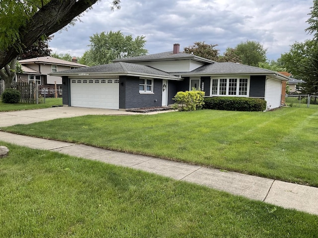624 Catalpa Ln, Bartlett, IL 60103 - tri-level home featuring a garage, driveway, a shingled roof, and brick siding