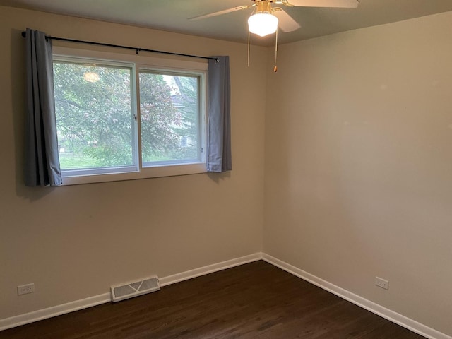 624 Catalpa Ln, Bartlett, IL 60103 - unfurnished room with baseboards, dark wood finished floors, and a ceiling fan