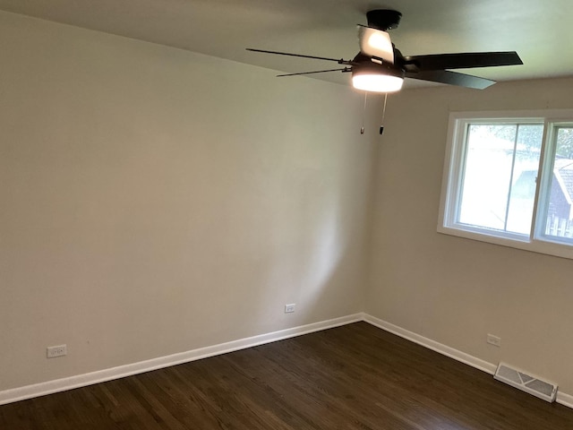 624 Catalpa Ln, Bartlett, IL 60103 - empty room with baseboards, dark wood-style floors, and a ceiling fan