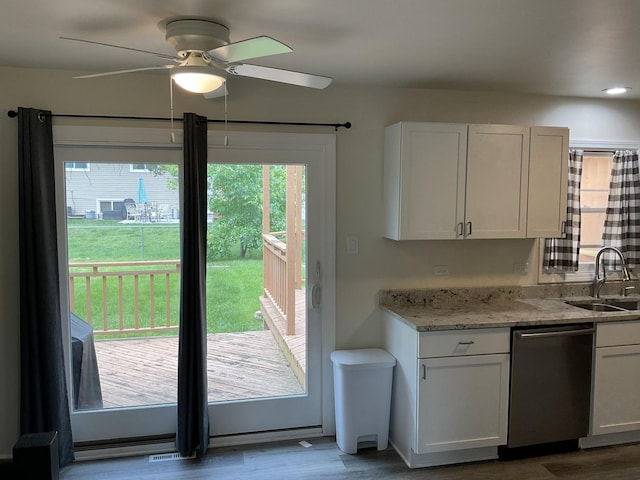 624 Catalpa Ln, Bartlett, IL 60103 - kitchen with dishwasher, a sink, a ceiling fan, and wood finished floors