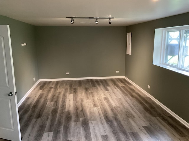 624 Catalpa Ln, Bartlett, IL 60103 - empty room with track lighting, dark wood-style floors, and baseboards