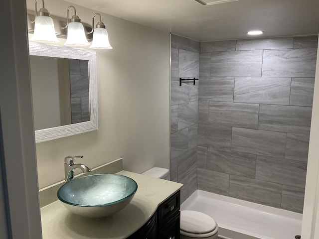 624 Catalpa Ln, Bartlett, IL 60103 - bathroom featuring toilet, vanity, and tiled shower