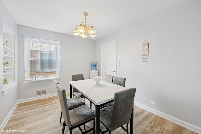 1933 N 75th Ave, Elmwood Park, IL 60707 - dining space with a chandelier and light wood-style flooring