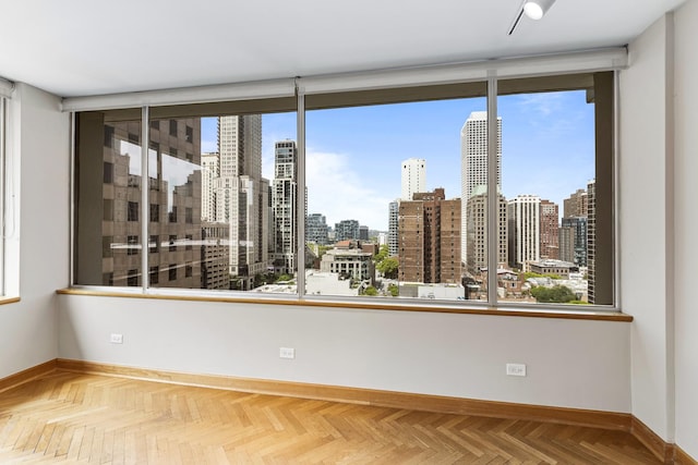1000 N Lake Shore Plz Unit 17C, Chicago, IL 60611 - spare room with baseboards and a view of skyline