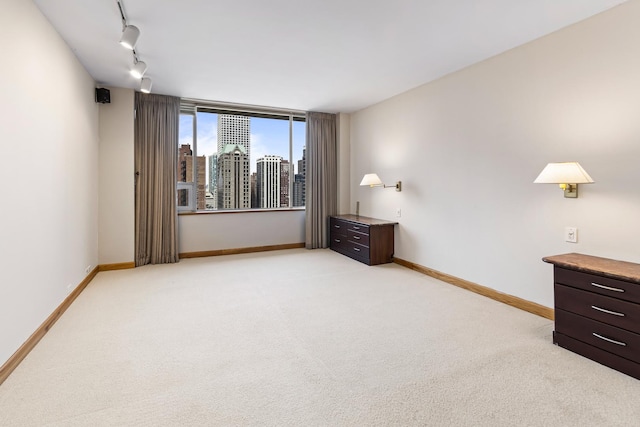 1000 N Lake Shore Plz Unit 17C, Chicago, IL 60611 - unfurnished bedroom featuring baseboards and light carpet