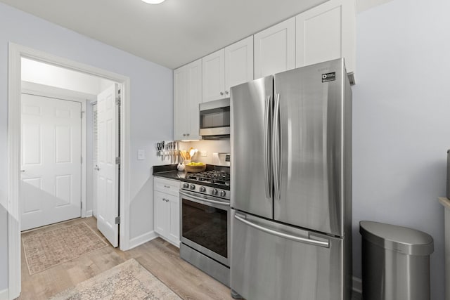 1693 Ashburn Ct Unit B, Wheaton, IL 60189 - kitchen with stainless steel appliances, light wood-style floors, white cabinets, and dark countertops