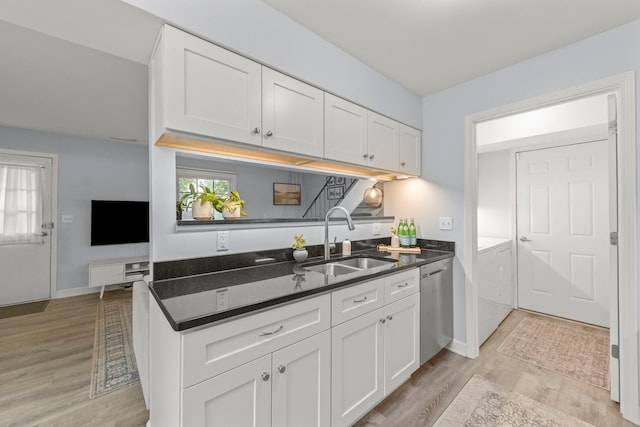 1693 Ashburn Ct Unit B, Wheaton, IL 60189 - kitchen featuring a sink, dishwasher, light wood-style flooring, white cabinetry, and washer and clothes dryer