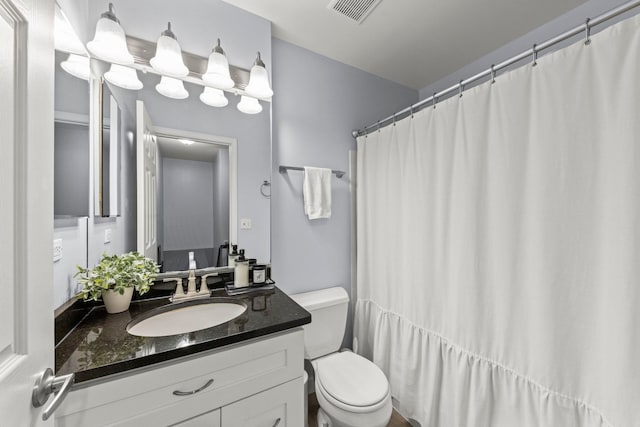 1693 Ashburn Ct Unit B, Wheaton, IL 60189 - bathroom with toilet, vanity, and a shower with shower curtain
