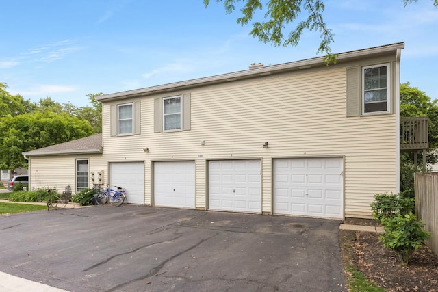 1693 Ashburn Ct Unit B, Wheaton, IL 60189 - view of front facade with driveway and an attached garage
