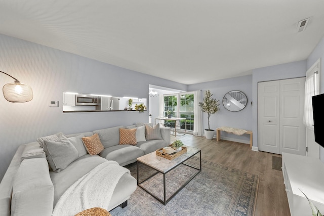 1693 Ashburn Ct Unit B, Wheaton, IL 60189 - living area featuring wood finished floors and baseboards